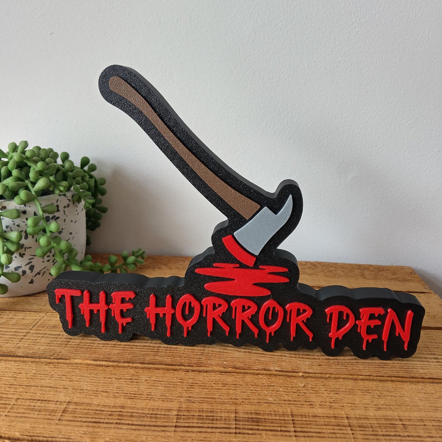 The Horror Den Sign